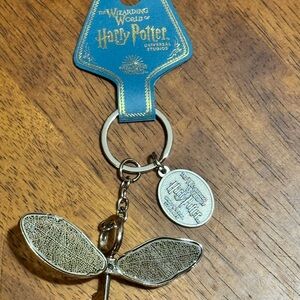 Warner Bros. Harry Potter Silver Snitch Keychain winged wizard and key